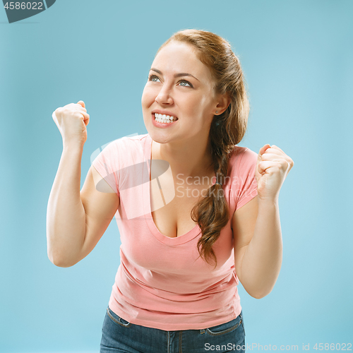 Image of Winning success woman happy ecstatic celebrating being a winner. Dynamic energetic image of female model
