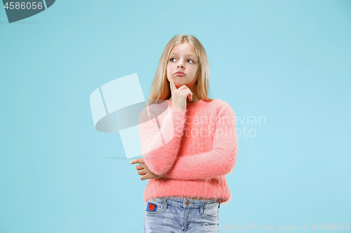 Image of Young serious thoughtful teen girl. Doubt concept.