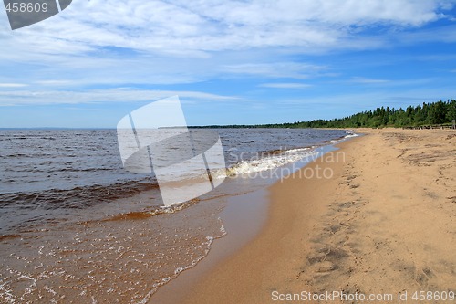 Image of Waves running over sand beach