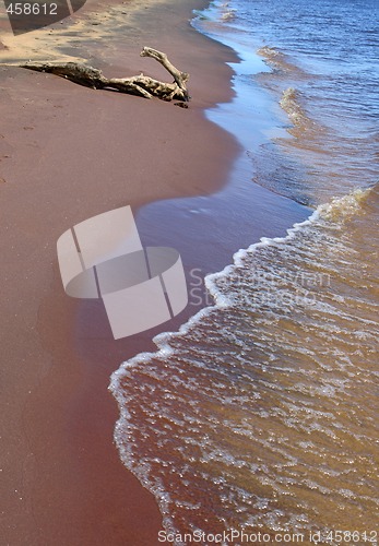 Image of Waves running over sand coast