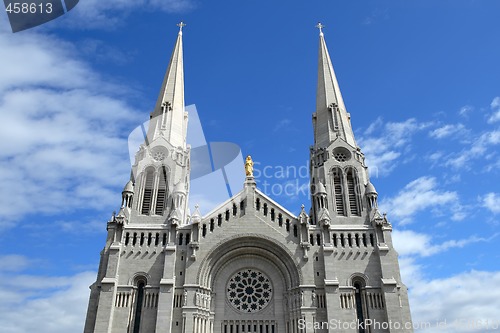 Image of Catholic church against blue sky