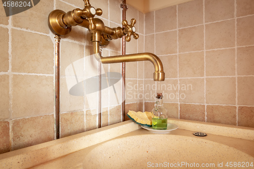 Image of vintage dishwashing sink in a kitchen in Italy