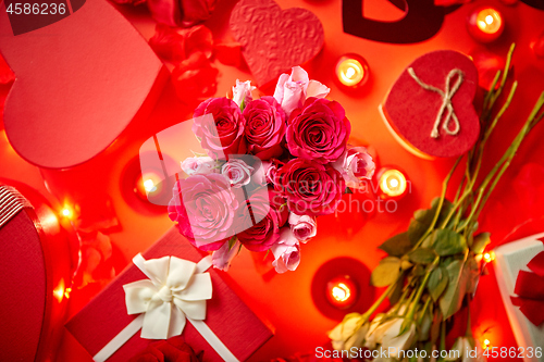 Image of Valentines day romantic decoration with roses, boxed gifts, candles