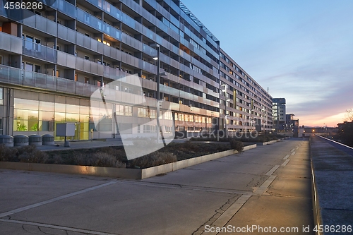 Image of Urban building blocks reflecting sunset light