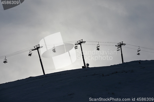 Image of Ski lift cloudy sky silhouette