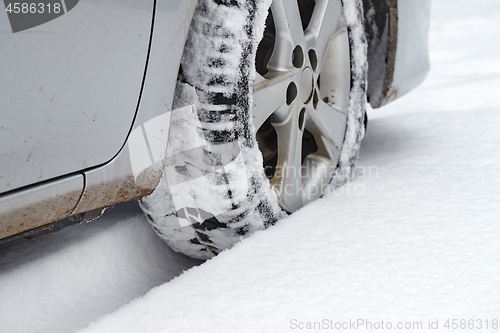 Image of Car tyre in snow