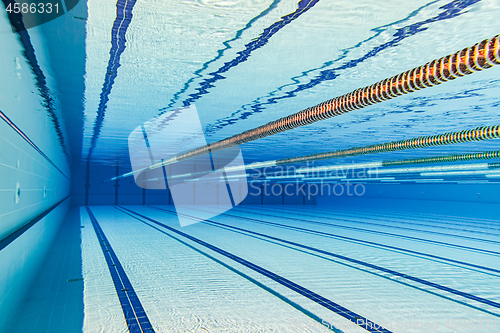 Image of Olympic Swimming pool under water background.