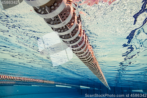 Image of Olympic Swimming pool under water background.