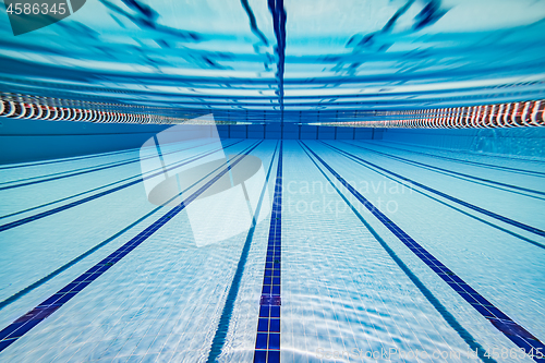 Image of Olympic Swimming pool under water background.