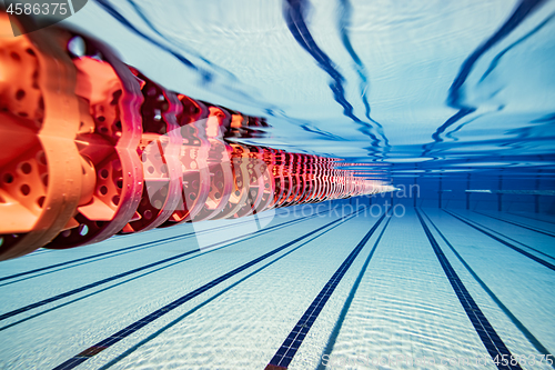 Image of Olympic Swimming pool under water background.