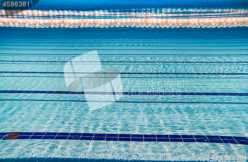 Image of Olympic Swimming pool under water background.