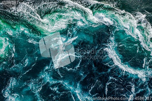 Image of Abstract background. Waves of water of the river and the sea mee