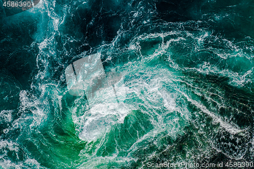 Image of Abstract background. Waves of water of the river and the sea mee