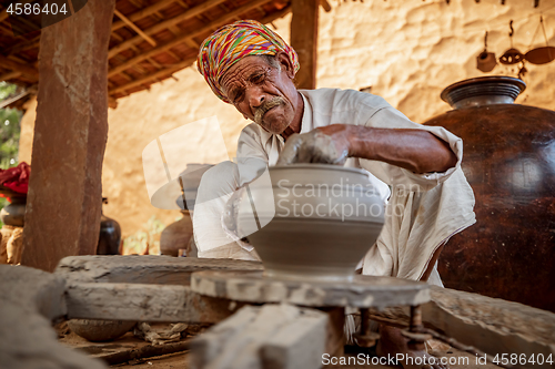 Image of Potter at work makes ceramic dishes. India, Rajasthan.