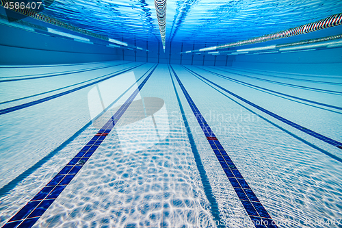 Image of Olympic Swimming pool under water background.