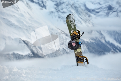 Image of Snowboard on a mountain top