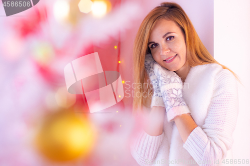 Image of Portrait of a close-up of a sympathetic blonde girl in a mare