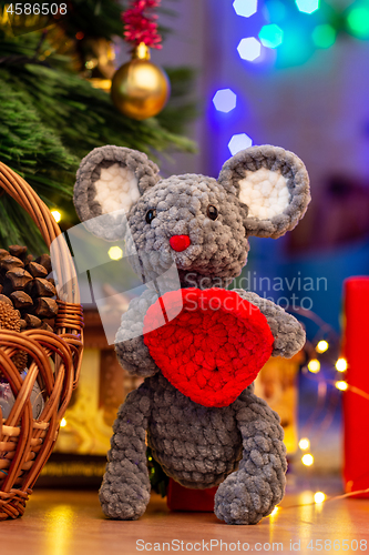 Image of Knitted toy mouse under the Christmas tree