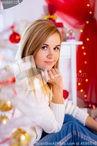 Image of Portrait of a close-up of a girl in the New Year\'s interior