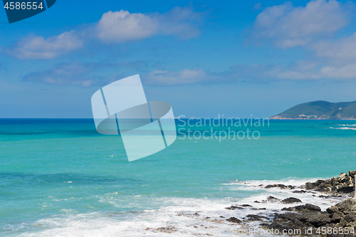 Image of Beautiful cerulean sea and the rocky beach