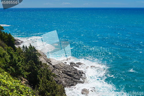 Image of Beautiful cerulean sea and the rocky beach