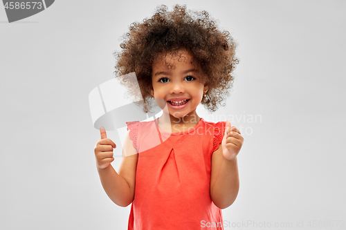 Image of little african american girl showing thumbs up