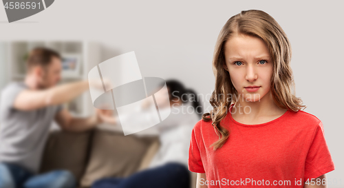 Image of unhappy girl over her parents having fight