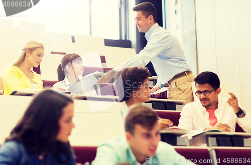 Image of teacher giving test to students on lecture