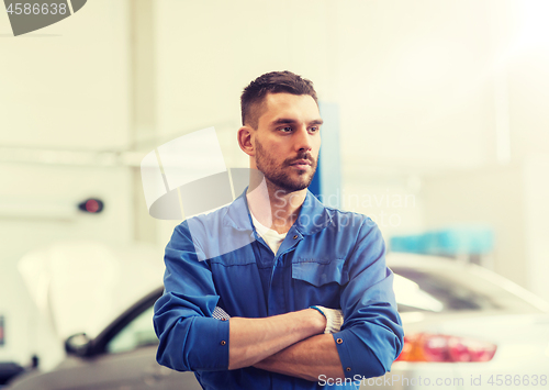 Image of auto mechanic man or smith at car workshop