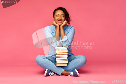 Image of happy african american student woman with books