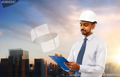 Image of architect in helmet with clipboard in tokyo