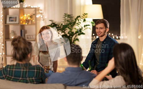 Image of friends drinking non-alcoholic beer at home