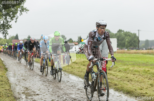 Image of The Peloton on a Cobblestone Road - Tour de France 2014