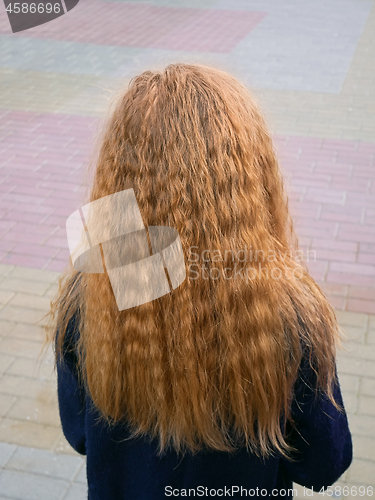 Image of Little girl with long flowing wavy blond hair