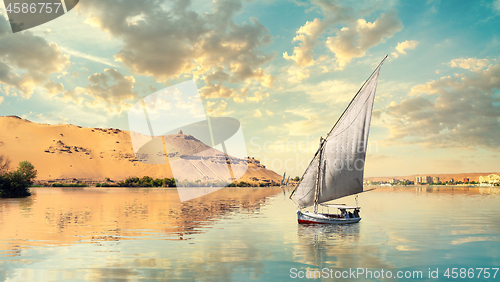 Image of Clouds and sailboat