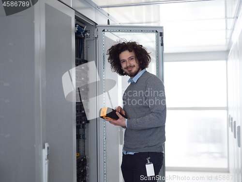 Image of technician using digital cable analyzer