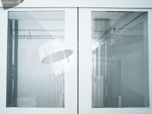 Image of modern server room with white servers