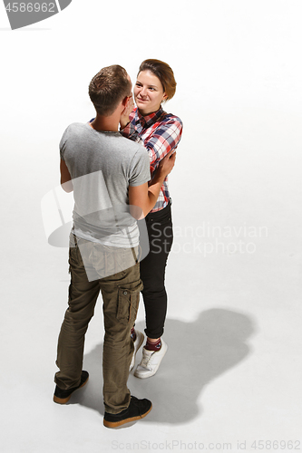 Image of Full body portrait of hugging couple with smile. Caucasian models in love