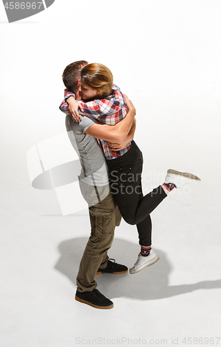 Image of Full body portrait of hugging couple with smile. Caucasian models in love