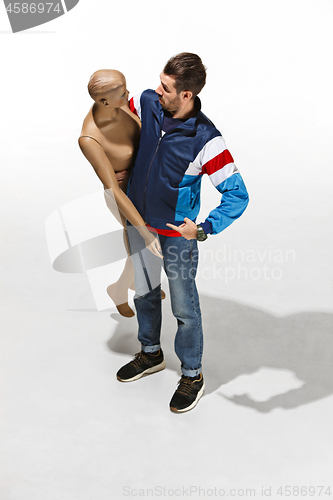 Image of Fashion woman body. The man hugging mannequin, perfect woman dream concept