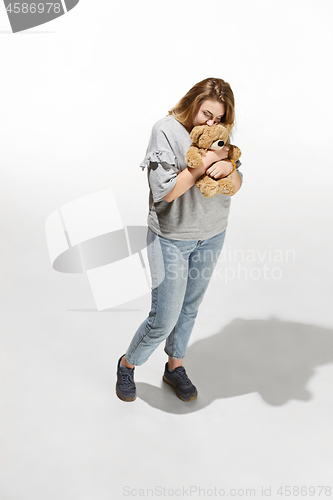 Image of Photo of pretty woman hug cute soft toy, closeup portrait of pretty female with teddy bear