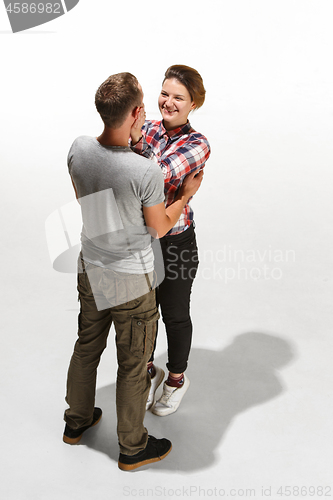 Image of Full body portrait of hugging couple with smile. Caucasian models in love