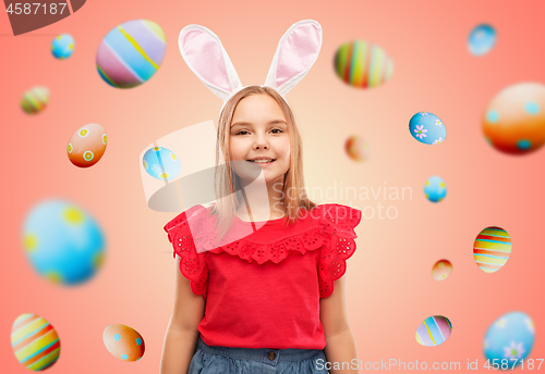 Image of happy girl wearing easter bunny ears headband