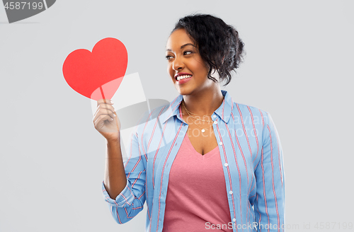 Image of happy african american woman with red heart