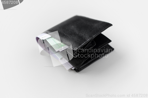 Image of close up of black wallet with euro money