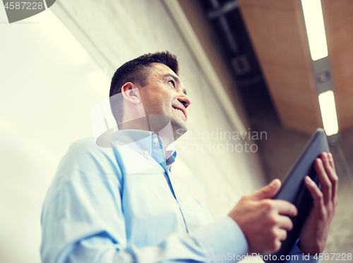 Image of teacher or lector with tablet pc at lecture