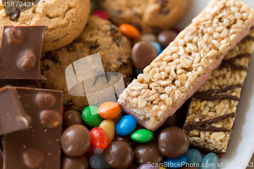 Image of chocolate, cookies, candies and muesli bars