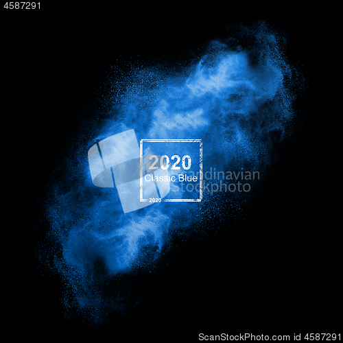 Image of Blue powder explosion in the trend color of the year 2020.