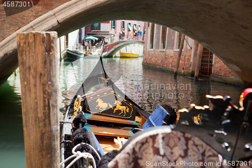 Image of Walking on the traditional italian gondola by the canal.