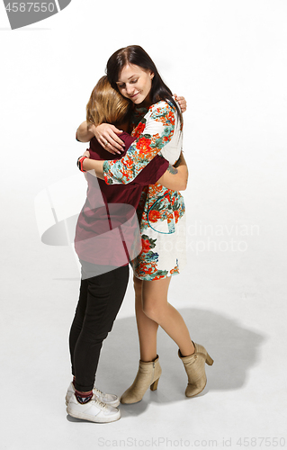 Image of Full body portrait of hugging couple with smile. Caucasian models in love